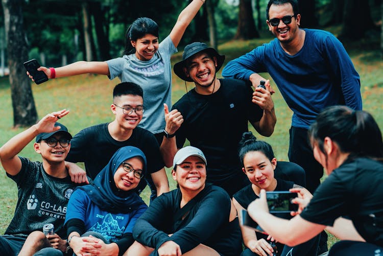 A group of people smiling a scenic hike at Taman Tugu