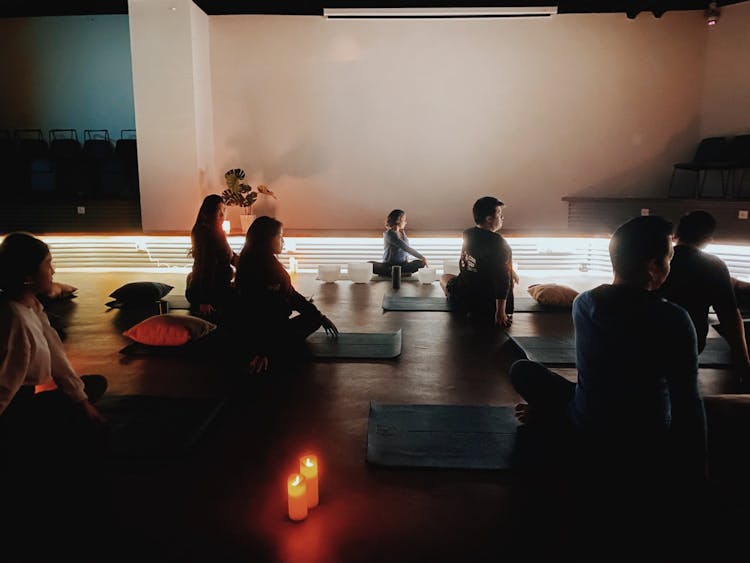 A group of people practicing yoga nidra at Co-labs Coworking